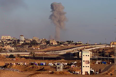 Smoke rises following an Israeli airstrike on buildings near the separating wall between Egypt and Rafah, southern Gaza Strip, Monday, May 6, 2024.