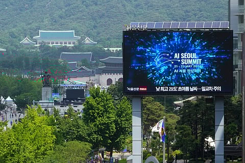 A screen shows an announcement of the AI Seoul Summit in Seoul, South Korea, Tuesday, May 21, 2024.