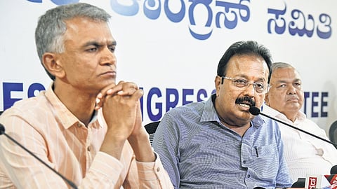 Agriculture Minister N Chaluvaraya Swamy addresses a press meet, as Revenue Minister Krishna Byregowda and Transport Minister R Ramalinga Reddy look on, in Bengaluru on Wednesday.