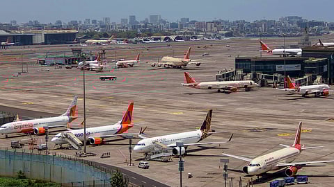 Air India and other planes parked at the airport in Mumbai, Thursday, May 9, 2024. 