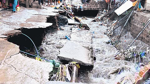 The collapsed slab of a nala at Uday Colony in Hyderabad on Thursday