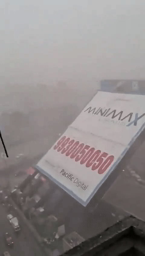 More than 100 people are feared trapped under the hoarding.