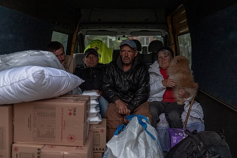 Olga Garmash (R), 68-years-old, with other evacuees from the village of Lyptsi, wait in a minivan at an evacuation point in Kharkiv, on May 11, 2024, amid the Russian invasion of Ukraine. 