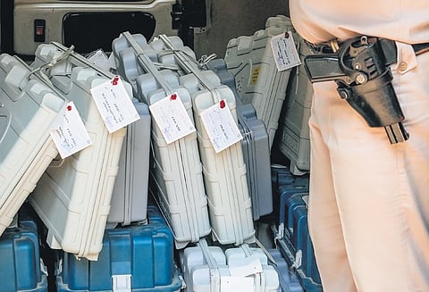 EVMs are marked according to the respective polling booths on Friday