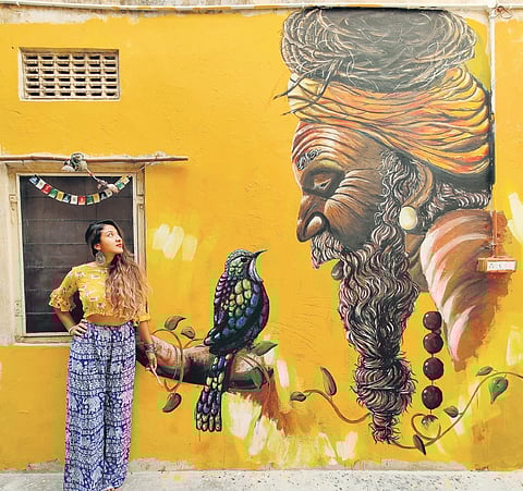 Sneha Chakraborty with her mural in Jaipur