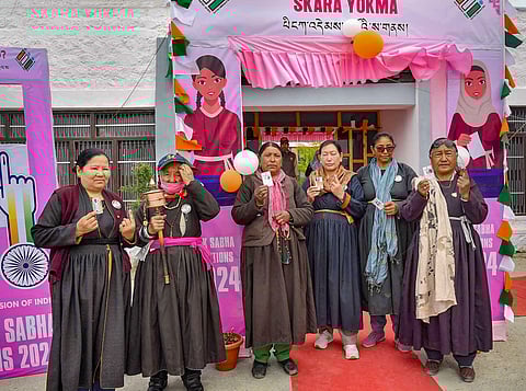 Voters show their fingers marked with indelible ink after casting their votes for the fifth phase of Lok Sabha elections, in Ladakh.