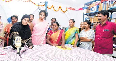 District Collector Valluru Kranthi oversees the cutting of cloth for making uniforms for government school students in Sangareddy