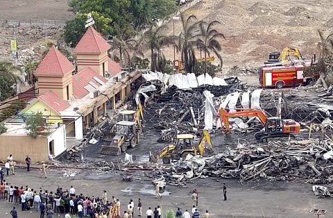 Debris being removed from the game zone site where a major fire on Saturday evening killed at least 27 people and injured three, in Rajkot, Sunday, May 26, 2024.