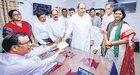 Chief Minister Naveen Patnaik handing over his nomination papers from the Kantabanji Assembly constituency at the sub-collector’s office in Titlagarh 