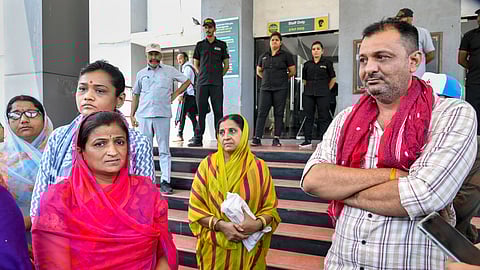 Gujarat Chief Minister Bhupendra Patel with officials and others at the game zone site where a major fire on Saturday evening killed at least 27 people and injured three, in Rajkot.