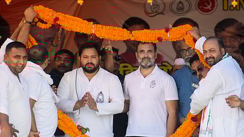 Congress leader Rahul Gandhi, RJD leader Tejashwi Yadav and CPI(ML) Liberation General Secretary Dipankar Bhattacharya being garlanded during a public meeting in Bihar.