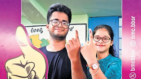 Youths show their inked fingers after casting their votes for the
 first time in Bhubaneswar, on Saturday