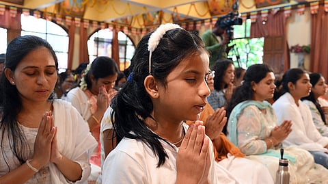 Devotees offers prayer on the occasion of the Buddha Purnima in Bengaluru on Thursday.