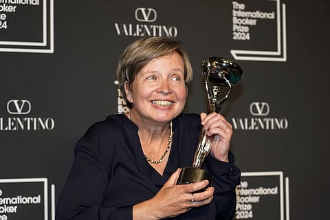 Jenny Erpenbeck, author of 'Kairos', holds the trophy after winning the International Booker Prize, in London, Tuesday, May 21, 2024.