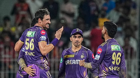 Knight Riders' Mitchell Starc with teammates celebrates after taking the wicket of Sunrisers Hyderabad batter Abhishek Sharma during the IPL 2024 final cricket match between SRH and KKR in Chennai Sunday, May 26, 2024.