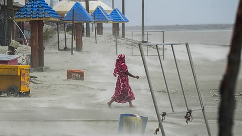 A villager at Bakkhali beach during a storm in the aftermath of Cyclone Remal's landfall, in South 24 Parganas district.