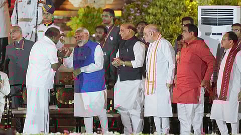 Prime Minister Narendra Modi greets JDS leader HD Kumaraswamy.