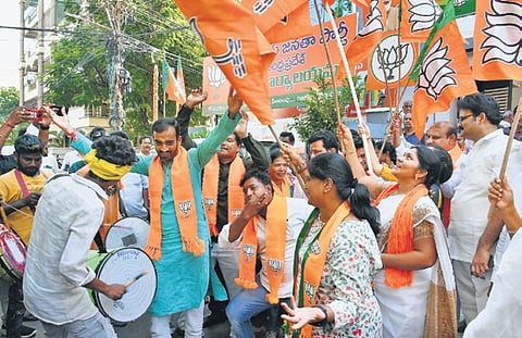 BJP cadre celebrating the win in Vijayawada on Tuesday 