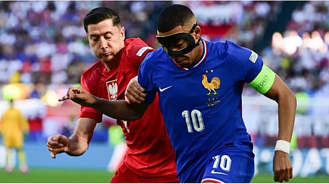Poland's forward #09 Robert Lewandowski fights for the ball with France's forward #10 Kylian Mbappe during the UEFA Euro 2024 Group D football match between France and Poland on June 25, 2024.