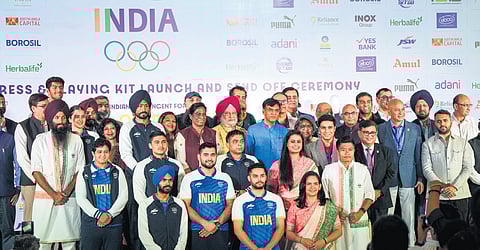 Union Sports Minister Mansukh Mandaviya, Union Minister of Petroleum & Natural Gas Hardeep Singh Puri and IOA chief PT Usha with athletes