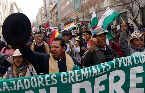 Merchants shout slogans during an anti-government march against the banks' lack of U.S. dollars, in La Paz, Bolivia, June 17, 2024.