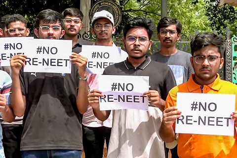Economic Offences Unit  personnel leave with the accused arrested in connection with the alleged irregularities in NEET-UG exams 2024.