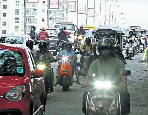 A sea of commuters inch their way 
acrosss the Goshree Bridge