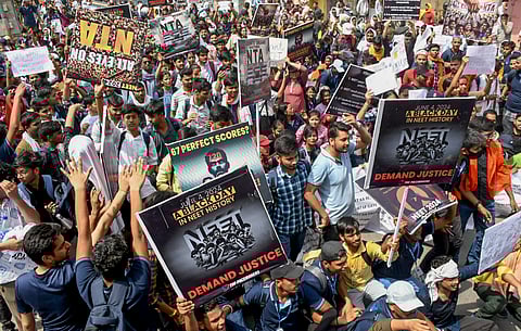 Members of various student organisations stage a protest against the alleged irregularities in the NEET-UG 2024 entrance exam result in New Delhi on Monday.