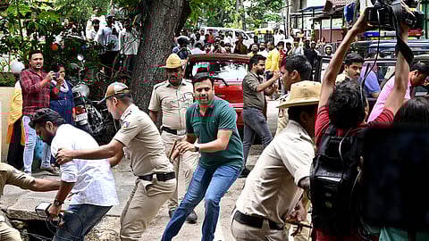 Police personnel manhandles and stops media to do their work as accuseds in a murder case of Renukaswamy, in which actor Darshan is also allegedly involvedand was taken out from Kamakshipalya police station, in Bengaluru on Tuesday. 