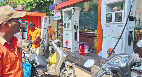 Motorists from Karwar refuel their vehicles at a petrol pump in Goa