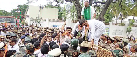 BJP workers led by state unit chief BY Vijayendra protest in Chitradurga on Friday 