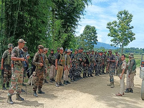 Security personnel during a search operation and area domination in the vulnerable areas of hill and valley districts of Manipur.
