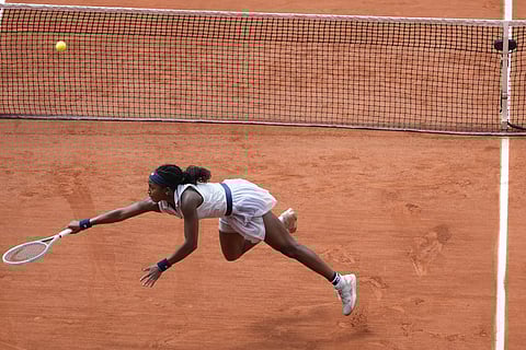 Coco Gauff of the US plays a shot against Tunisia's Ons Jabeur during their quarterfinal match of the French Open tennis tournament at the Roland Garros stadium in Paris, Tuesday, June 4, 2024.