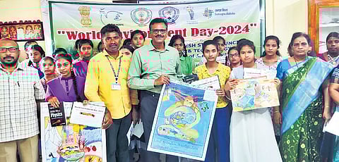 District Education Officer UV Subbarao presenting certificates and prizes to the winners of poster presentation competition organised by APSCST I Express