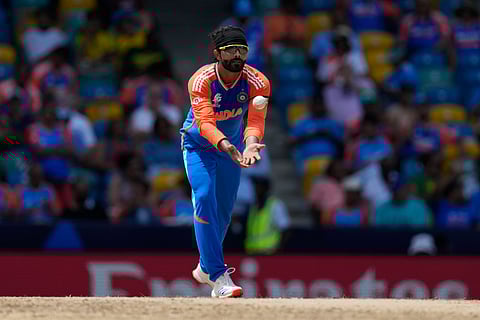 India's Ravindra Jadeja fields the ball after bowling a delivery during the ICC Men's T20 World Cup cricket match between Afghanistan and India