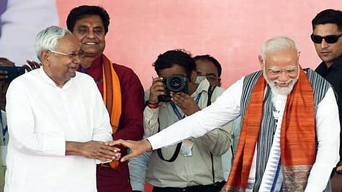 PM Narendra Modi with JD(U) leader and Bihar CM Nitish Kumar's JD(U).
