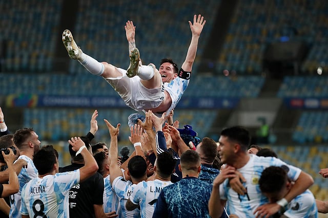 Teammates toss Messi in the air after beating Brazil 1-0 in the Copa America final