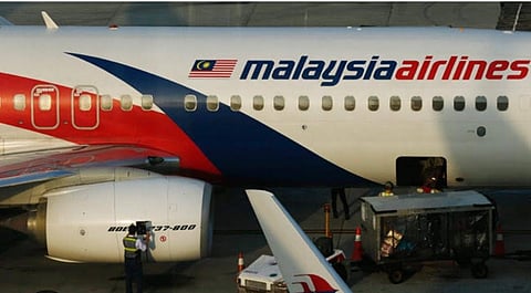 Technical staffs checking Hyderabad-Kuala Lumpur bound Malaysia Airlines 