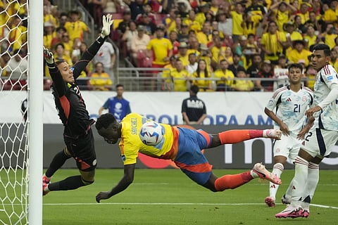 Costa Rica's goalkeeper Patrick Sequeria, left, stops a shot by Columbia's Davinson Sanchez during a Copa America Group D soccer match in Glendale, Ariz., Friday, June 28, 2024.