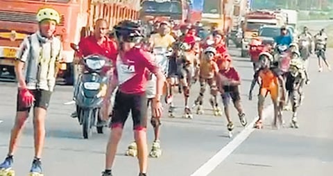 A screengrab from the video clip showing children skating on the highway