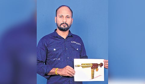 Jayesh Natarajan with the design of the twin magazine rifle