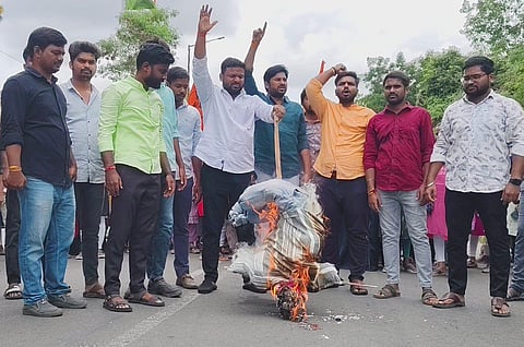 ABVP activists burn an effigy representing the National Testing Agency during a protest at the Osmania University.