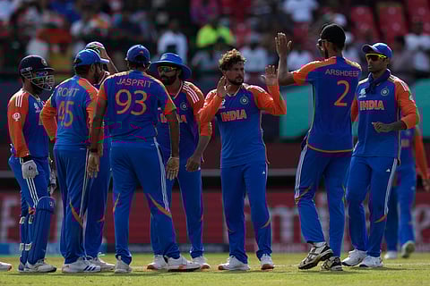 India's Kuldeep Yadav, center without cap, celebrates with teammates after the dismissal of England's Harry Brook during the ICC Men's T20 World Cup second semifinal cricket match between England and India on June 27, 2024. 