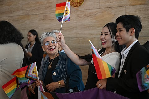 Members of the LGBTQ community arrive at Parliament ahead of the final senatorial vote on the same-sex marriage bill in Bangkok on June 18, 2024.