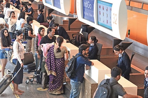 File photo of passengers checking in