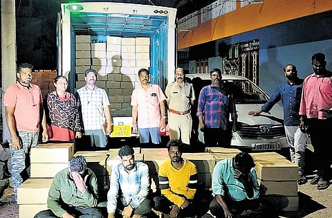 Special police team with the seized liquor and the accused near Ulundurpet
