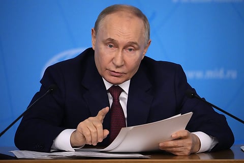 Russian President Vladimir Putin speaks during a meeting at the Russian Foreign Ministry in Moscow, Russia, Friday, June 14, 2024.