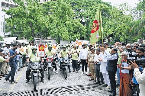 Home Minister Dr G Parameshwara flags off the bike rally.
