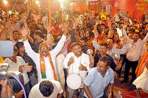 BJP supporters celebrate the party's victory in the Odisha Assembly and Lok Sabha election results, in Bhubaneswar on Tuesday.