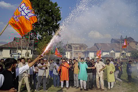 BJP supporters celebrate the party's lead during the counting of votes for the Lok Sabha elections, in Srinagar, Tuesday, June 4, 2024. 